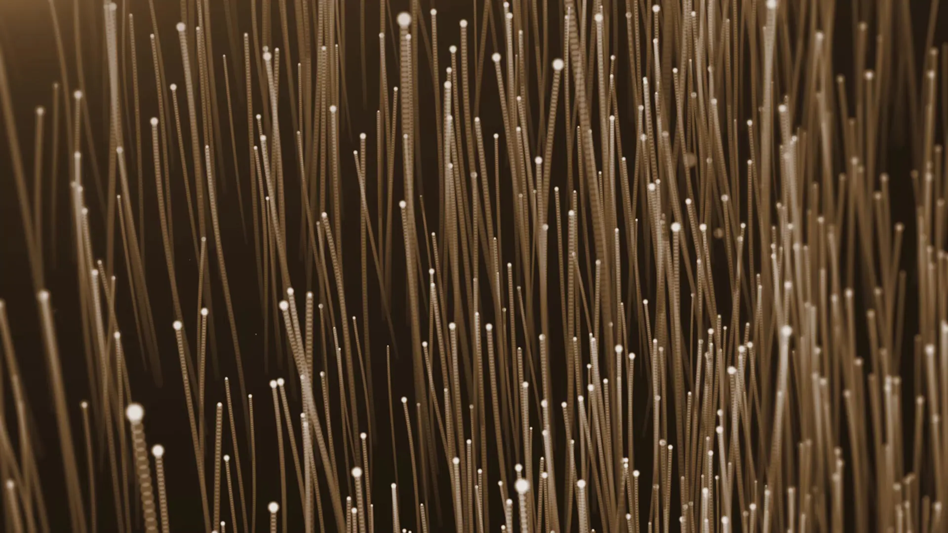 Abstract rendering of filaments with luminous tips, suggesting microbial growth.